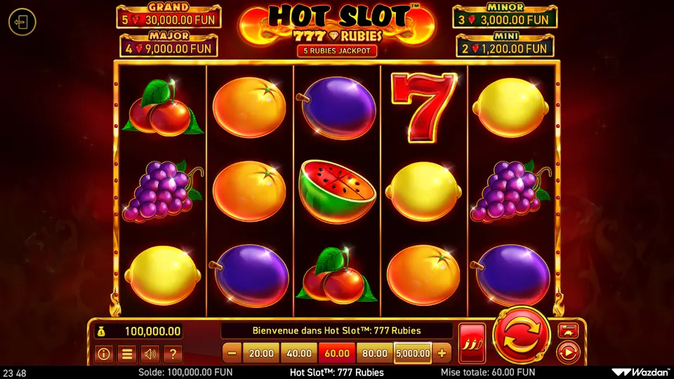 Grille de 5 rouleaux sur 3 rangées de Hot Slot 777 Rubies avec des fruits et un 7 rouge ; en haut, les compteurs GRAND 30 000, MAJOR 9 000, MINOR 3 000 et MINI 1 200 FUN
