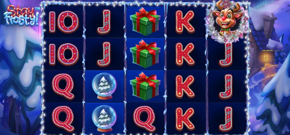 Grille de Stay Frosty! dans un décor enneigé : lettres 10, J, Q, K en rouge, cadeaux verts, boules à neige et une tête de renne dans une couronne