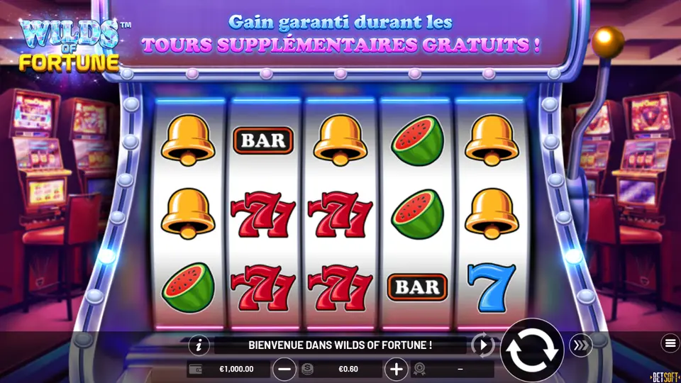 Grille de 5 rouleaux de Wilds of Fortune dans une machine à sous à manette : cloches dorées, BAR, triples 7 rouges, pastèques et un 7 bleu ; en haut, le bandeau Gain garanti durant les TOURS SUPPLÉMENTAIRES GRATUITS ; en bas, la mise €0.60